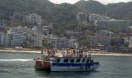 Cruise the bay on a catamaran, one of the many things to do when you buy a condo for sale in Puerto Vallarta.