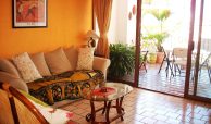 Traditional living room with outdoor terrace with lots of sun light in Marina las Palmas, Puerto Vallarta.