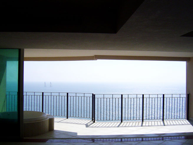 Gorgeous view of the Bay of Banderas from living room, dining room and kitchen area at Grand Ventian, beachfront condos for sale in Puerto Vallarta