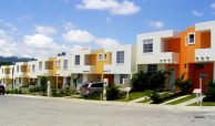 White, yellow and orange two story town homes for sale in Bucerias on a sunny day.