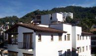 Selva Romantica building enclave in the jungle mountains of Puerto Vallarta on a sunny day.