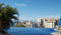 Infinity swimming pool with views of downtown Puerto Vallarta.