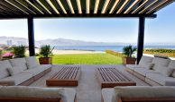 Relax and sit around the pergola area in your beachfront villa with views of the mountains and coastline. Beachfront villas for sale in Puerto Vallarta.