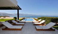 Amazing views of the beach, water and mountains in the background on a sunny day from your private lounge and swimming pool area, villas for sale in Puerto Vallarta.