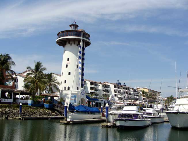 Marina Vallarta Lighhouse boardwalk, marina front condos and yachts.